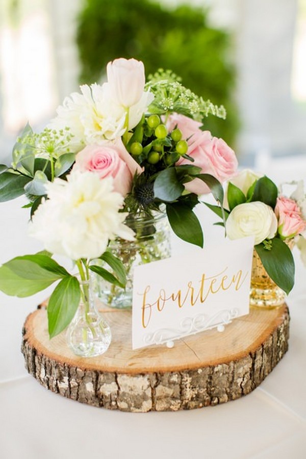chic rustic wedding centerpiece with wooden stand