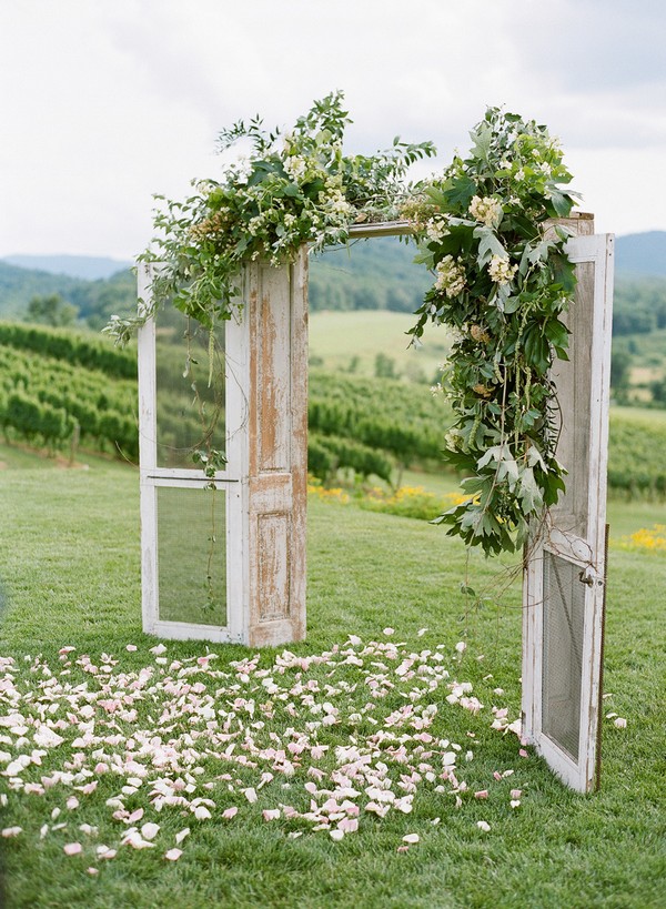 rustic floral decorated wedding arch ideas with door