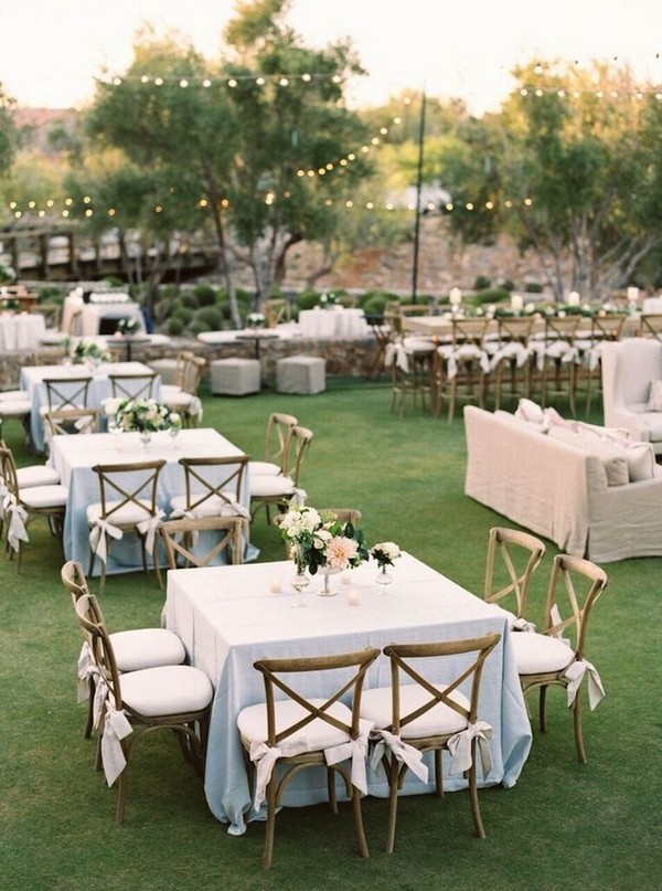 Gorgeous outdoor wedding reception set up with square tables