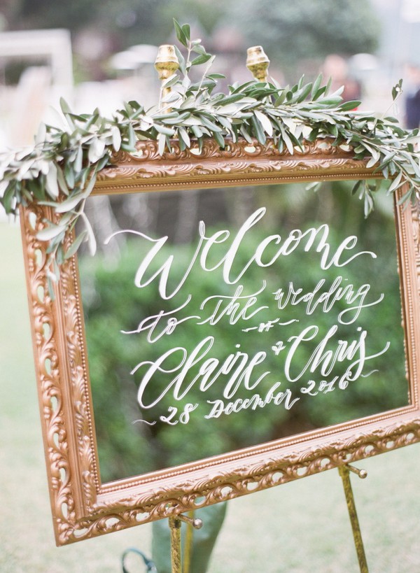 greenery and gold framed mirror wedding sign