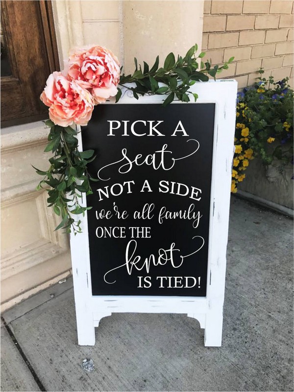 wedding chalkboard sign with pink and green decorations