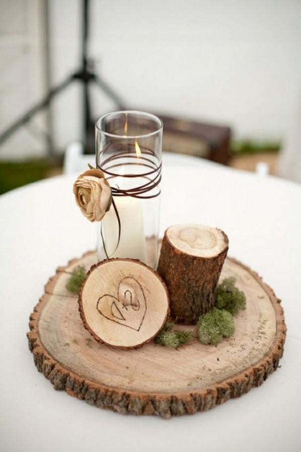 simple country wedding centerpiece with tree stumps