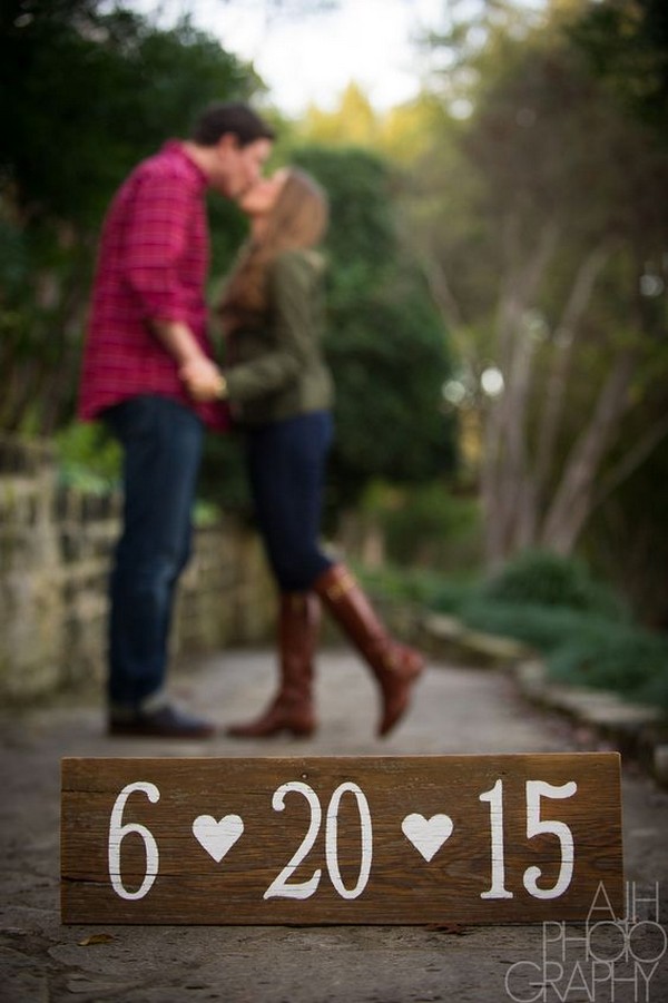 Creative engagement photo ideas with a customized date sign capture the love.