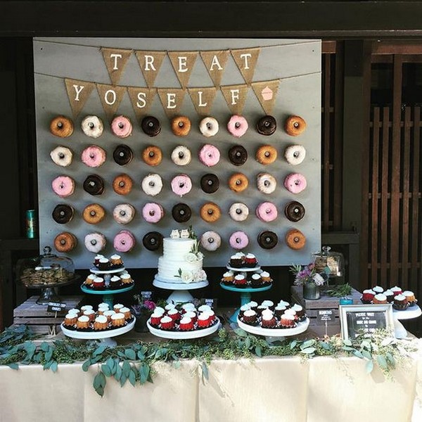 rustic wedding dessert bar with donuts wall