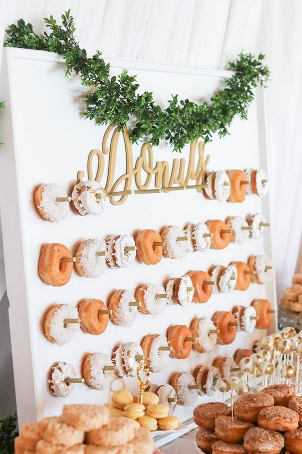 white and greenery chic wedding donuts wall