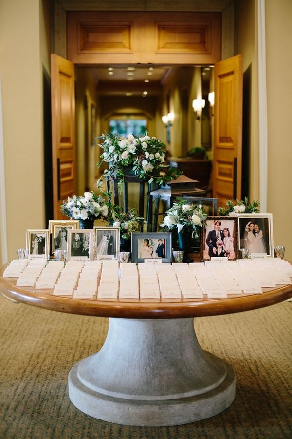 elegant wedding place card table with wedding photos