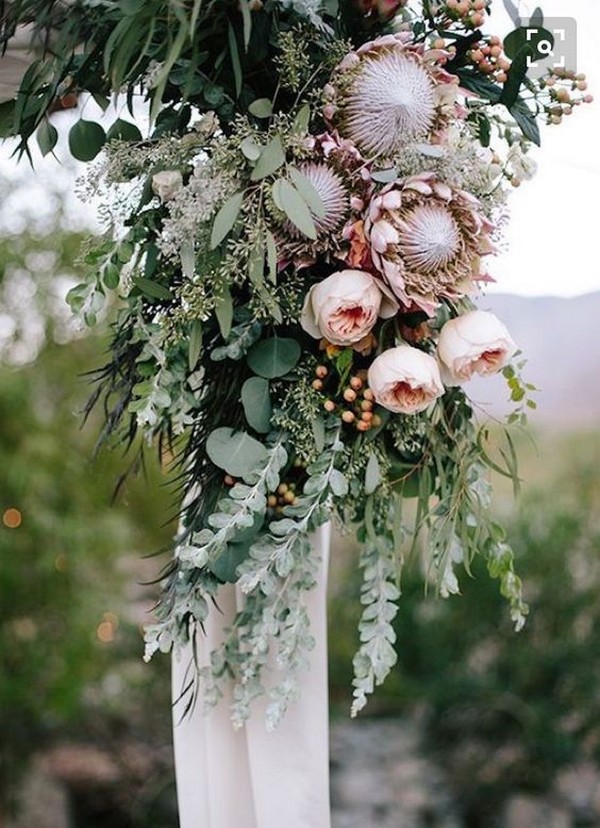 blush and greenery decorated wedding arch ideas