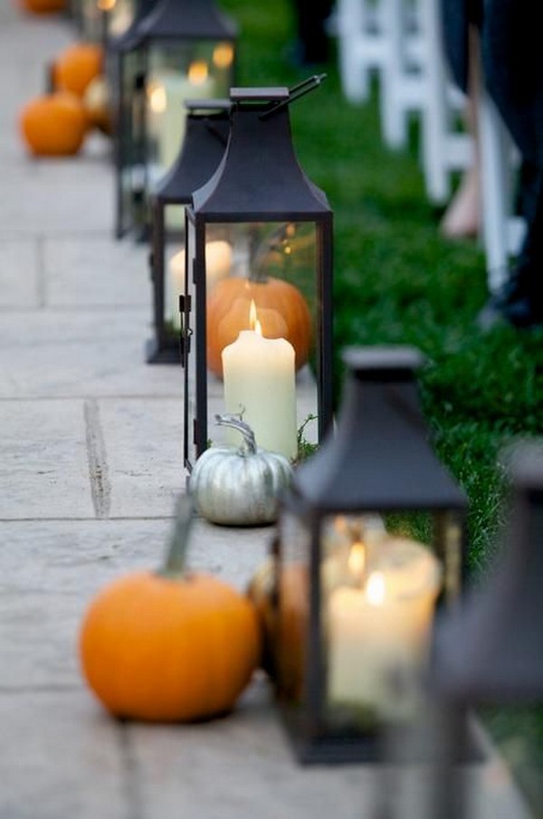 fall wedding aisle with pumpkin and lanterns