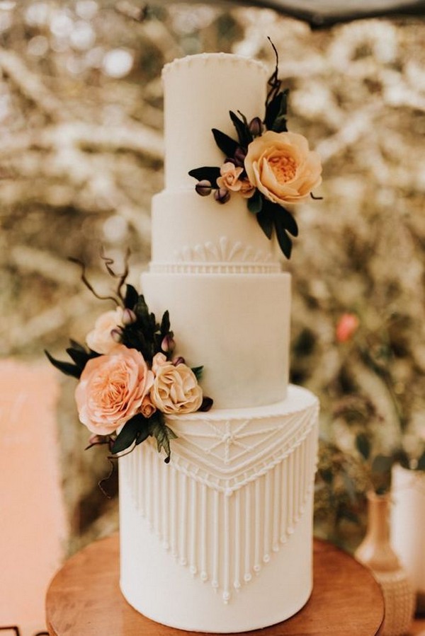 elegant wedding cake with sunset orange floral