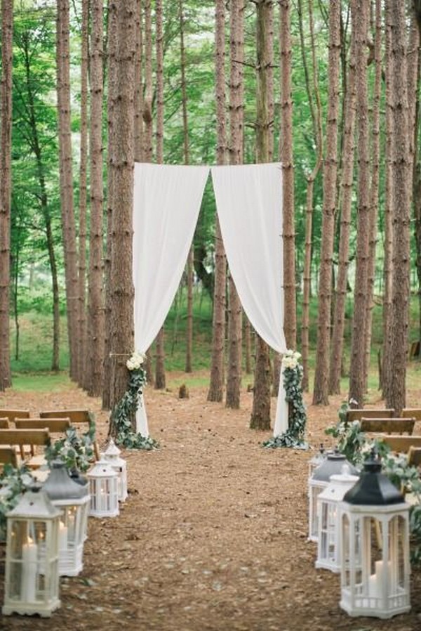 forest inspired wedding aisle ideas with lanterns