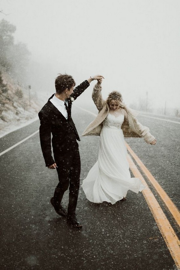 dancing in the snow winter wedding photo ideas