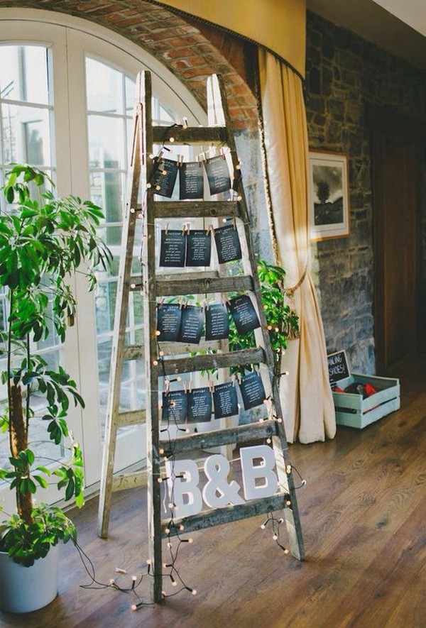 rustic wedding seating chart display ideas with vintage ladders