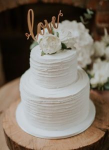 Elegant White Wedding Cake With Monogram 218x300 