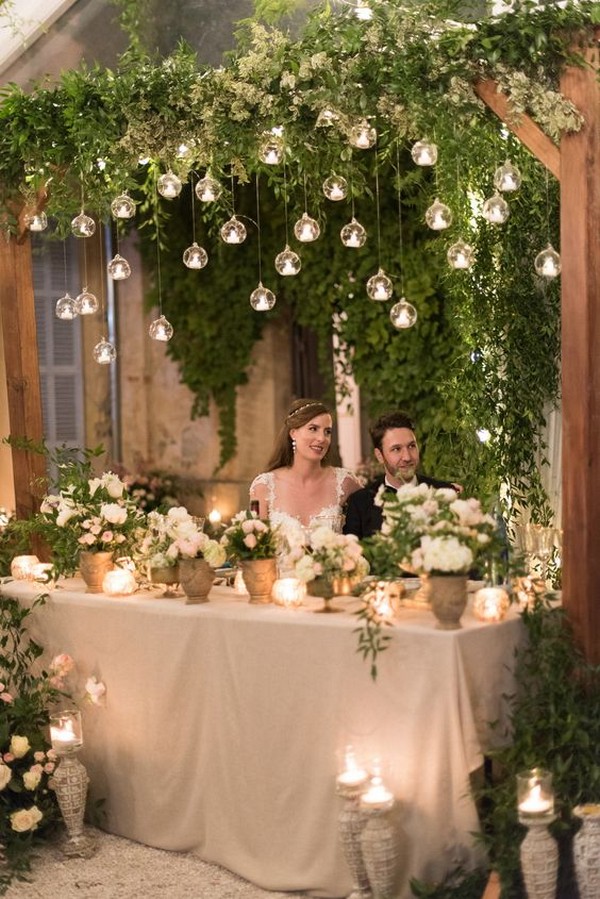 greenery wedding sweetheart table decoration ideas with hanging candles