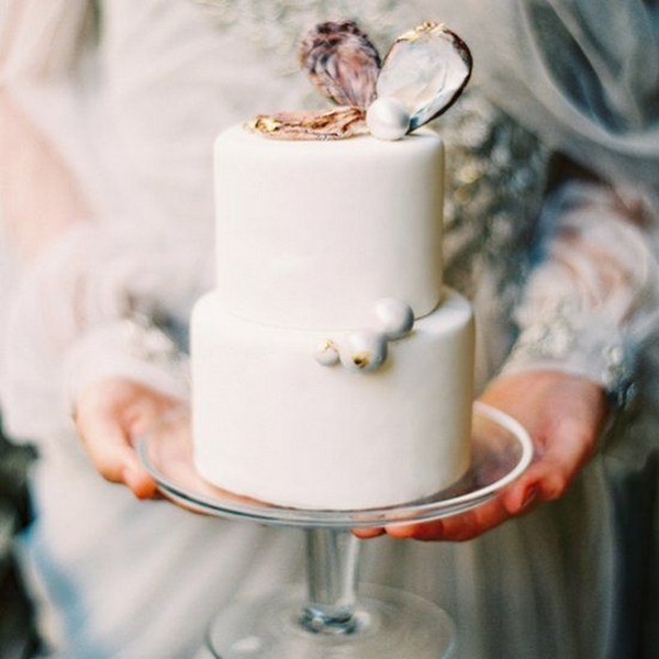 elegant pearl and geode beach wedding cake