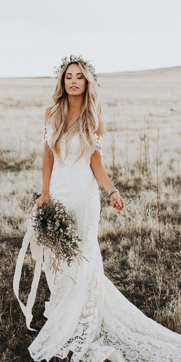An off the shoulder country lace wedding dress is a statement of timeless elegance and grace that accentuates the beauty of the bride and creates a lasting memory of an unforgettable moment.