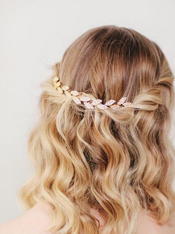 Unleash your inner goddess with a timeless and romantic half-up half-down wedding hairstyle