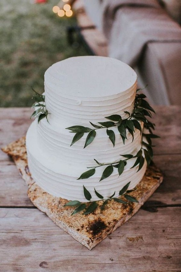 simple and rustic wedding cake with greenery
