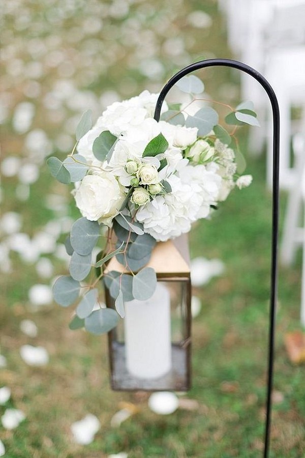 Wedding ceremony aisle ideas with hanging gold lantern and hydrangeas