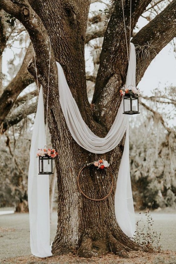 budget friendly diy wedding backdrop ideas with drapery and lanterns