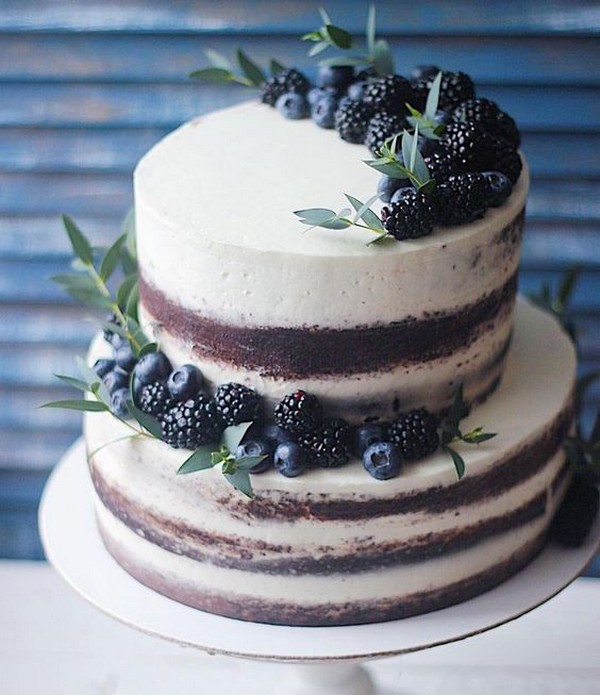 simple wedding cake with cherries and greenery