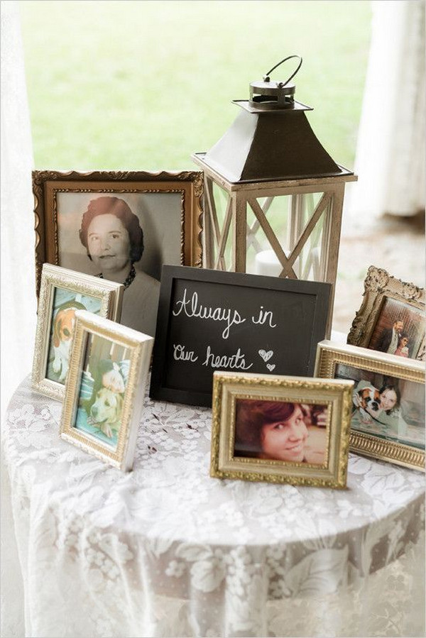 wedding memorial table with photos to honor loved ones