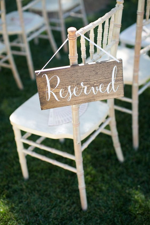 simple wood reserved sign for wedding ceremony