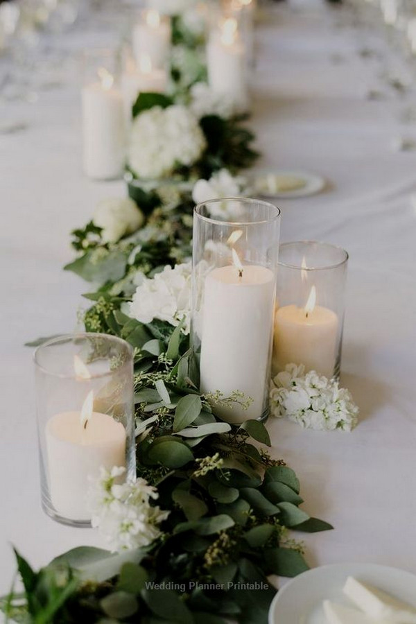 candles and seeded eucalyptus wedding centerpiece with candles