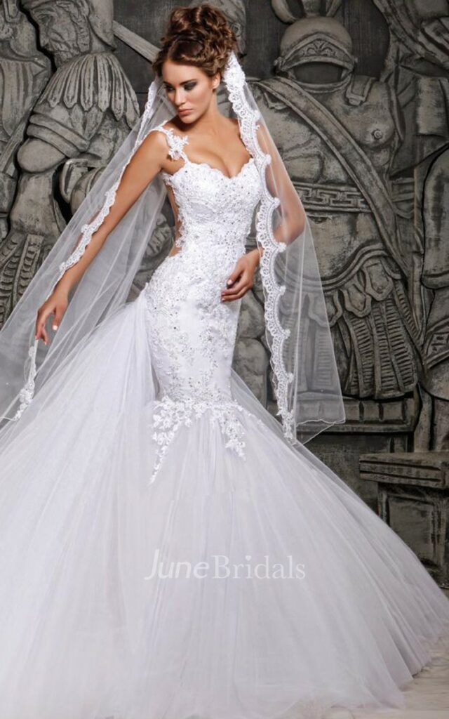 This stunning Mexican mermaid  wedding dress with lace embellishments and a tulle skirt is great with a matching wedding veil