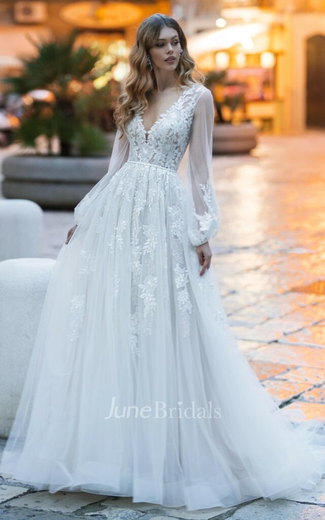 This lovely V-neck Mexican wedding A-line dress has delicate lace embellishments, a dramatic court train, and intricate appliques.