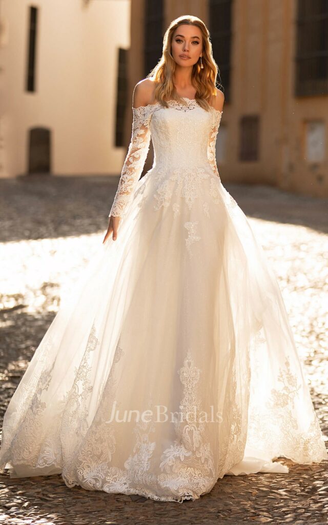 Bohemian grace is captured in this magnificent off-the-shoulder A-line Mexican bridal dress with a dramatic court train and delicate appliques.