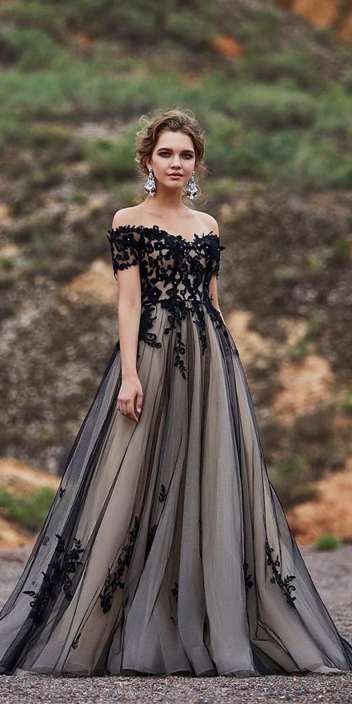 Elegant and daring, this black wedding dress features an off-the-shoulder design and an A-line silhouette.