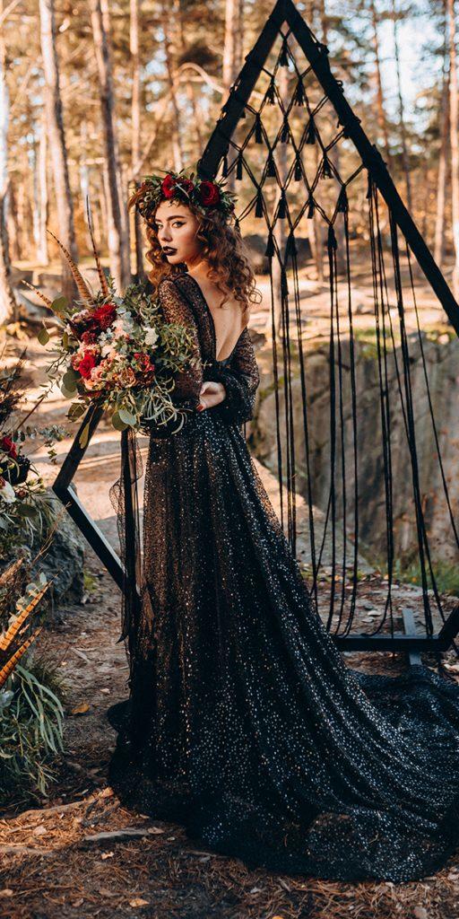 Enjoy the dark allure of gothic black wedding dresses and contrast it with a bright and colorful bouquet to show off your unique flair.