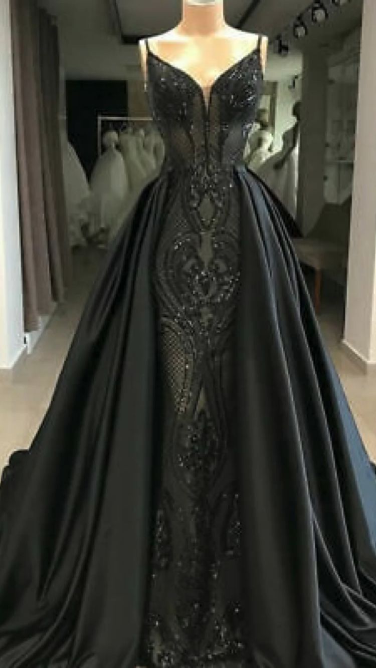 For a really magical ceremony, choose this stunning black lace mermaid dress.

