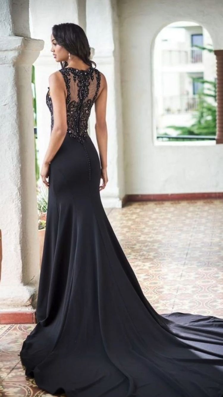 Dreamy black jersey mermaid dress with a chapel train for the bride.

