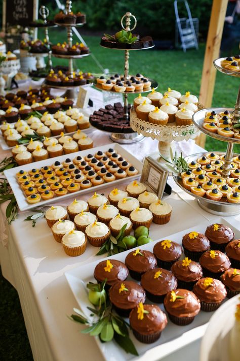This dessert bar with a selection of cupcakes is ideal for a rustic wedding 