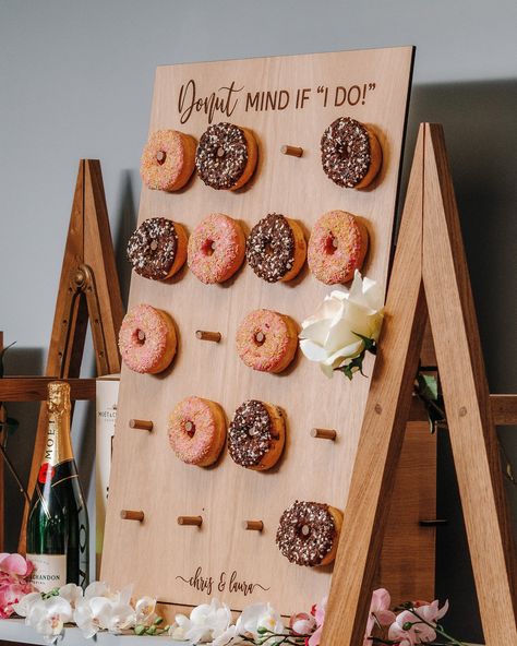 The doughnut wall display board at the dessert table will be the talk of the wedding 