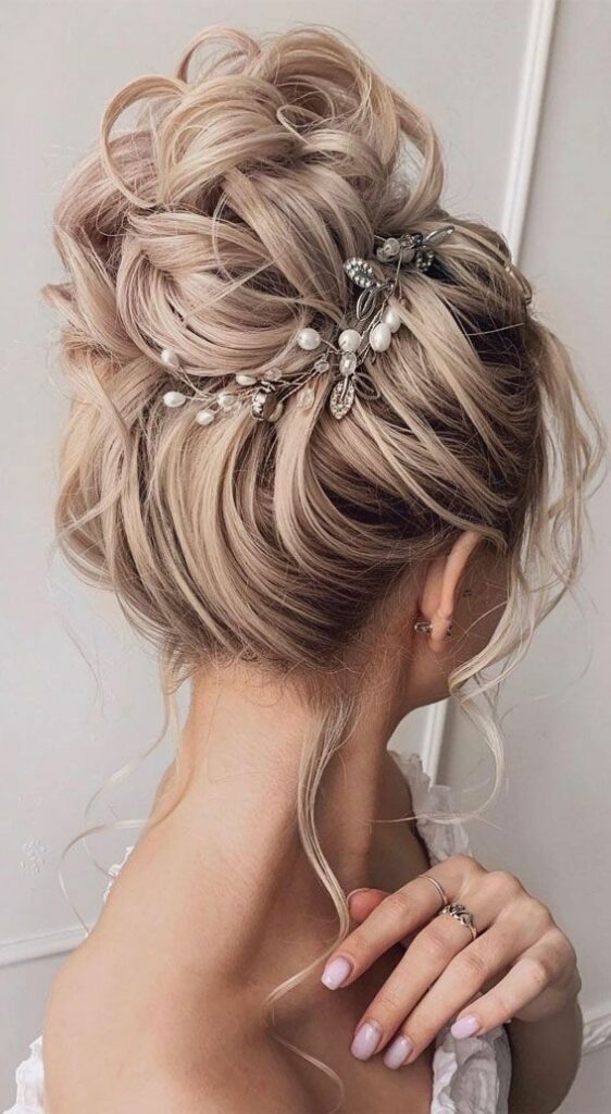 This medium length wedding hairstyle is ideal for outdoor weddings, as it keeps your hair off your neck and face.