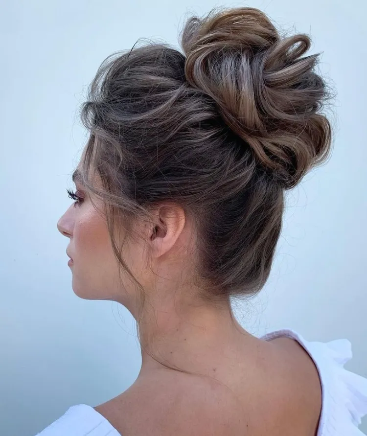 This medium length messy bun wedding hairstyle is low-maintenance, so you can focus on enjoying your special day.