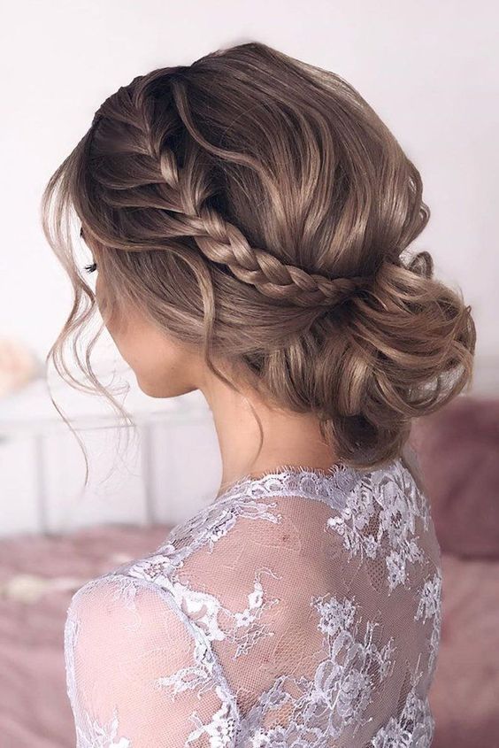 You can add some personal touches to your French braided updo for medium hair by incorporating flowers, hairpins, or delicate accessories.