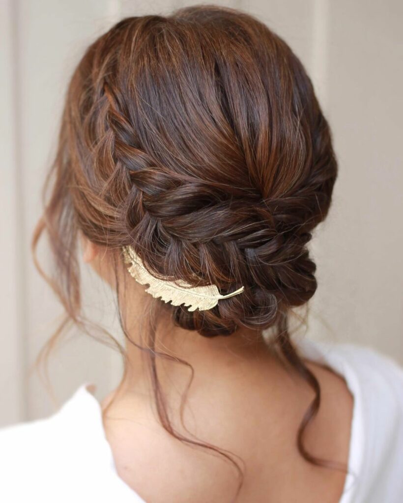 The French braid adds a touch of intricacy and texture to the updo, making it a stunning choice for medium length hair.