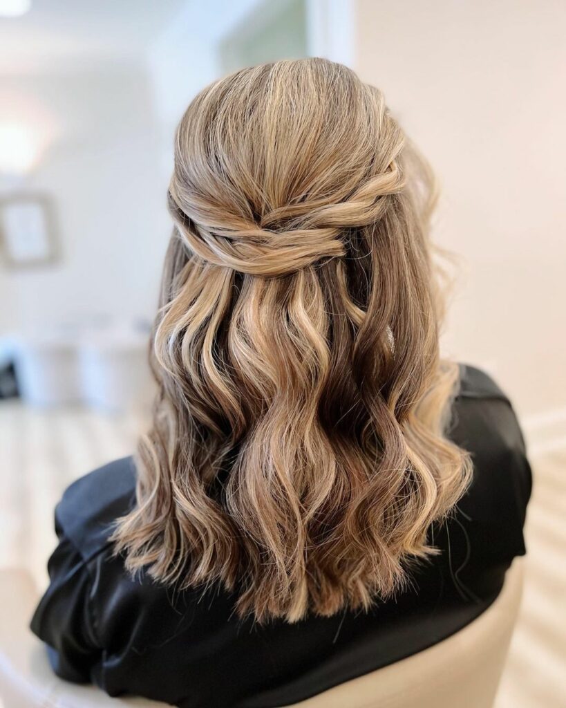 Easy and romantic best describe half up, half down wedding hairstyles for medium hair.