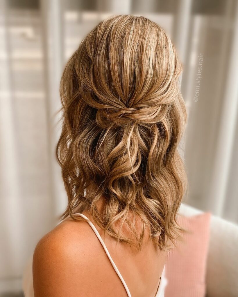 This wedding hairstyle offers a versatile option for brides who want to showcase their medium-length hair.