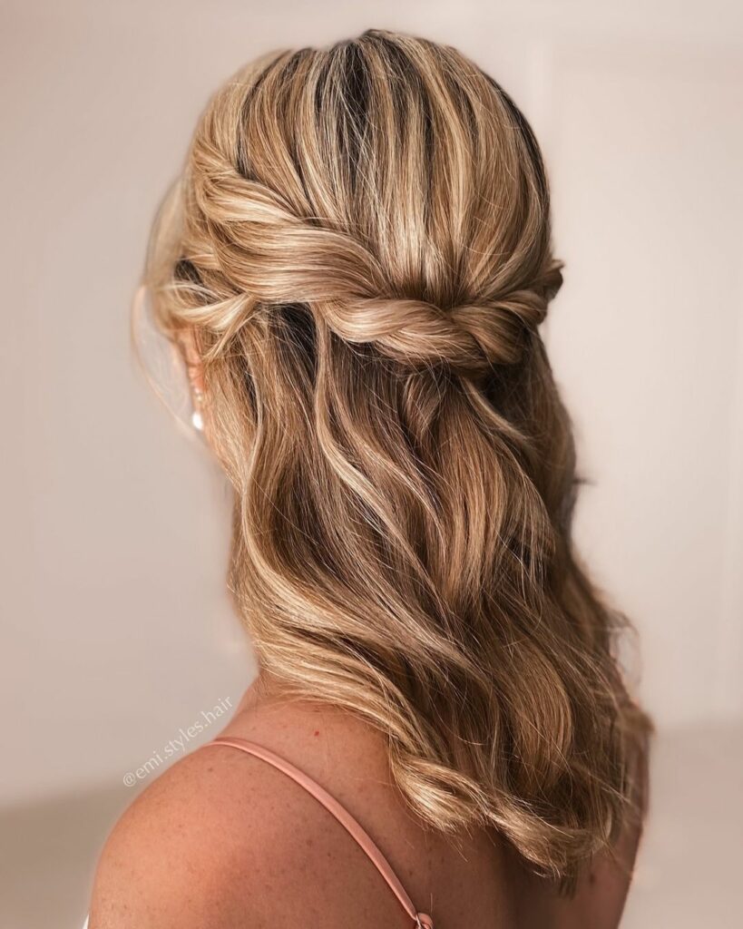A Half Up Half Down medium length Wedding Hairstyle is perfect for brides who want a balance between an updo and loose curls.