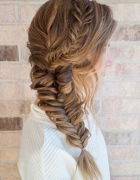 A loose braid hairstyle for medium hair is versatile and can be dressed up or down with the right accessories.