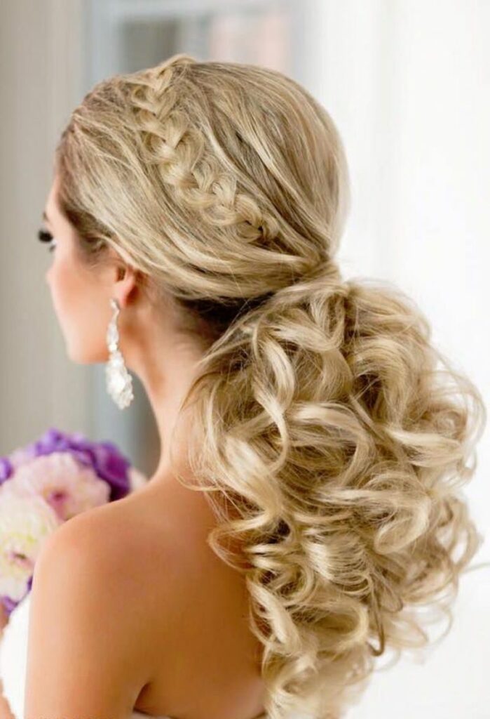 Add some texture to your ponytail for medium hairstyle by teasing the crown and adding some loose waves.