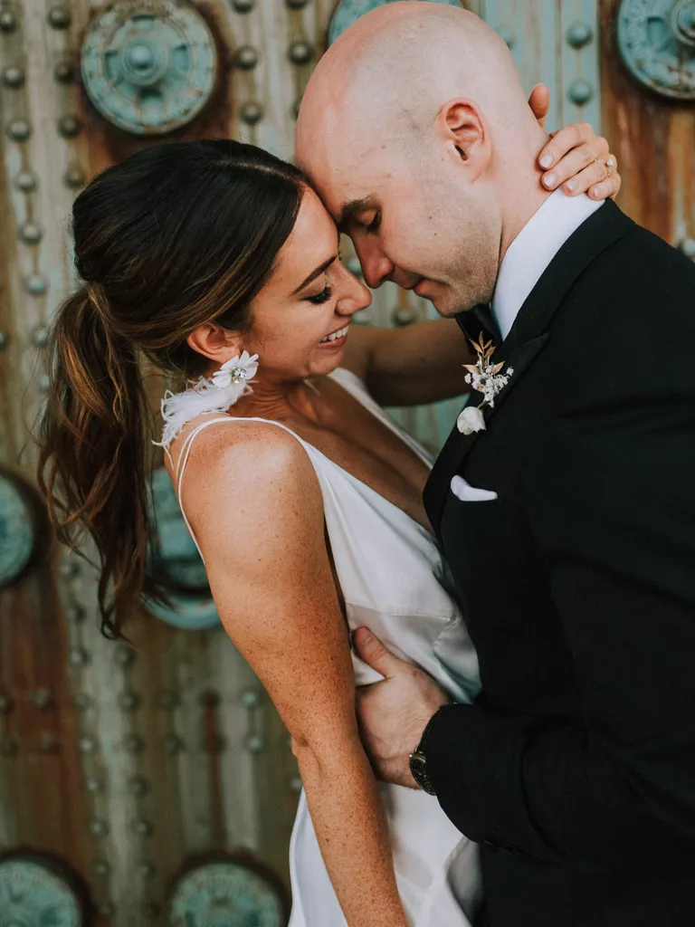 A sleek and low ponytail can be a chic and effortless idea for medium length wedding hair.