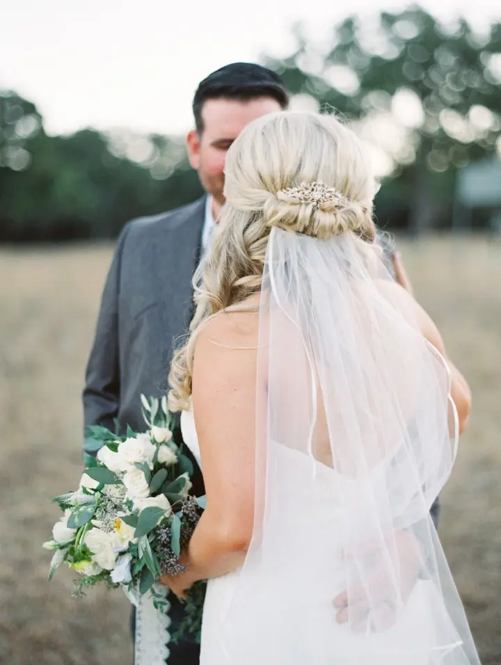 A half up, half down wedding hairstyle for medium hair is a stylish and great idea for todays modern bride.