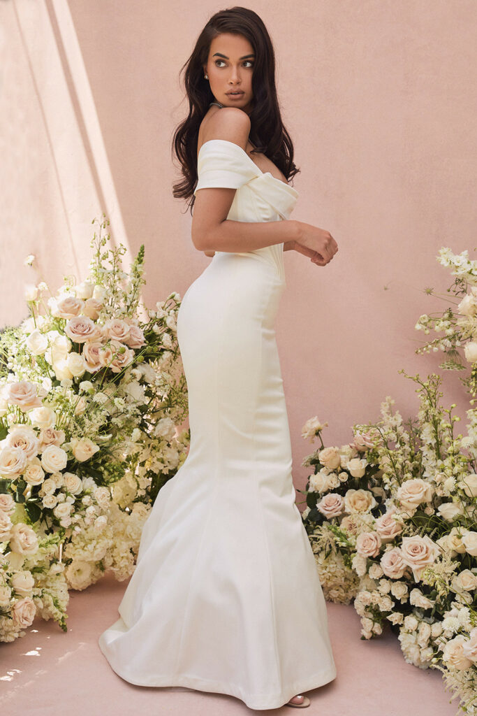 Wearing this sexy off-the-shoulder wedding dress will make you just as captivating on your big day.
