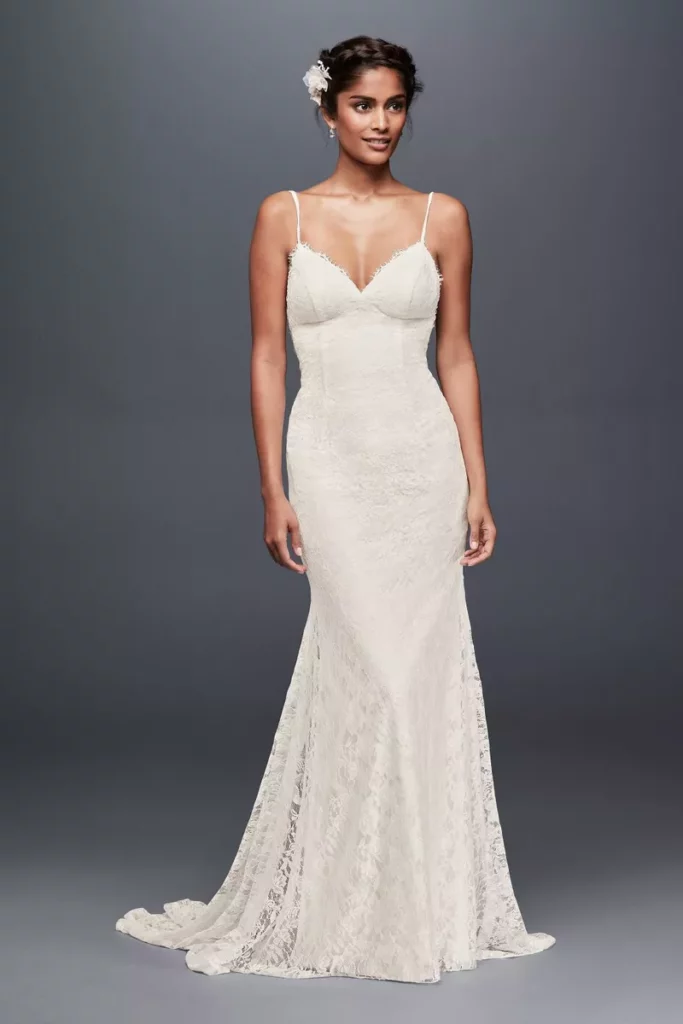 Beautiful figure-flattering lace wedding dress with a low back.